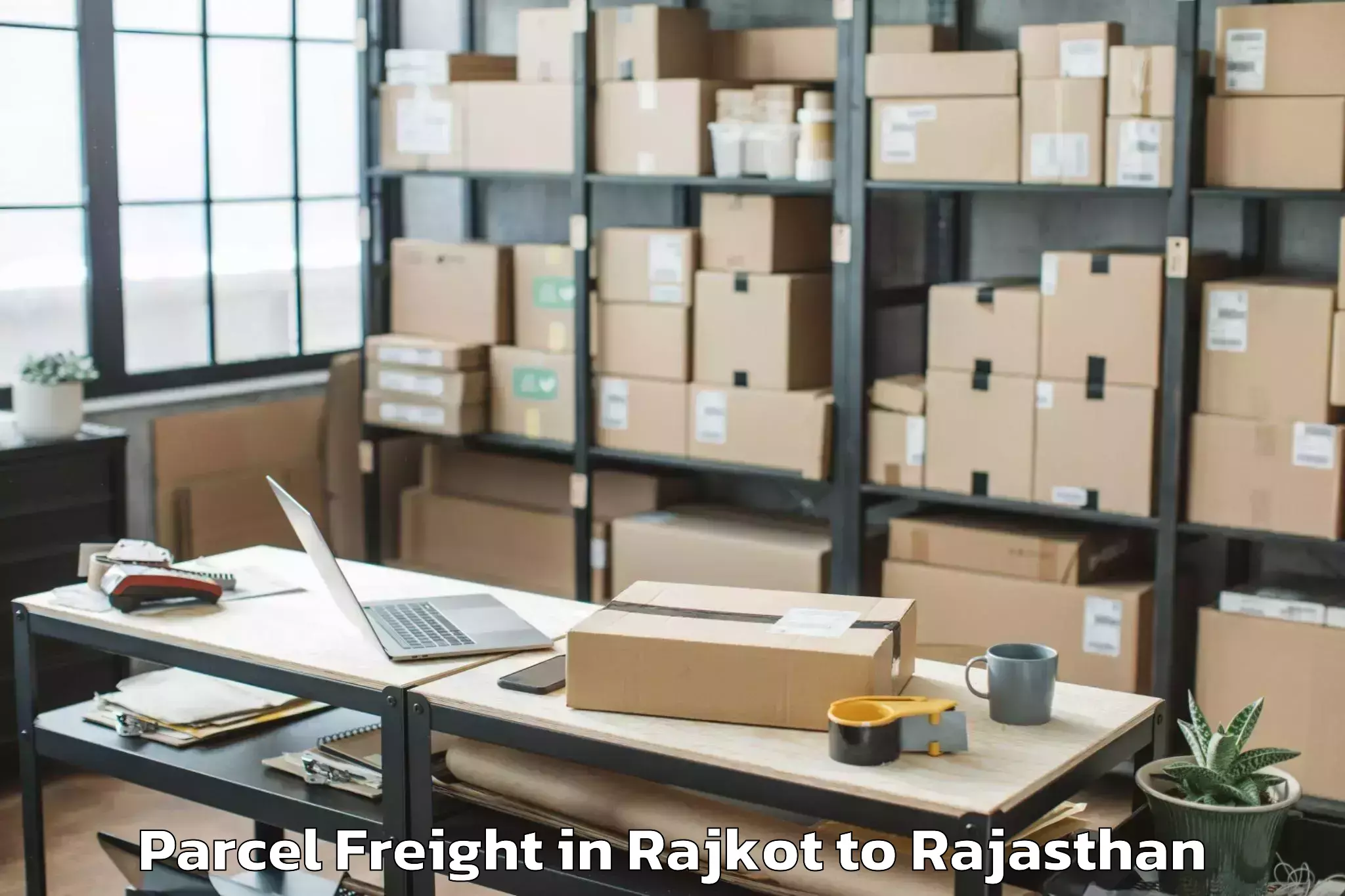 Easy Rajkot to Chauth Ka Barwara Parcel Freight Booking